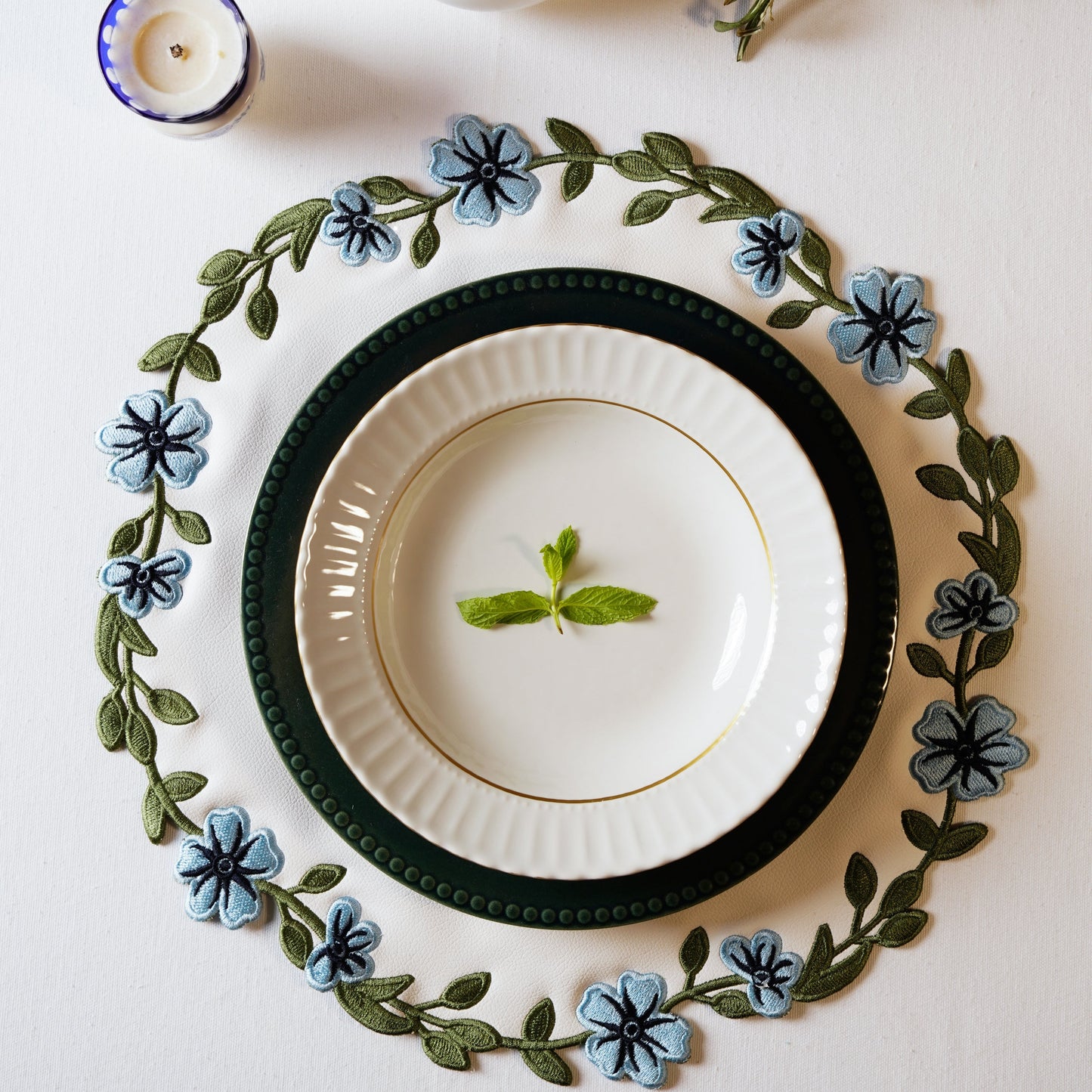 Unity White Embroidered Faux Leather PLacemat